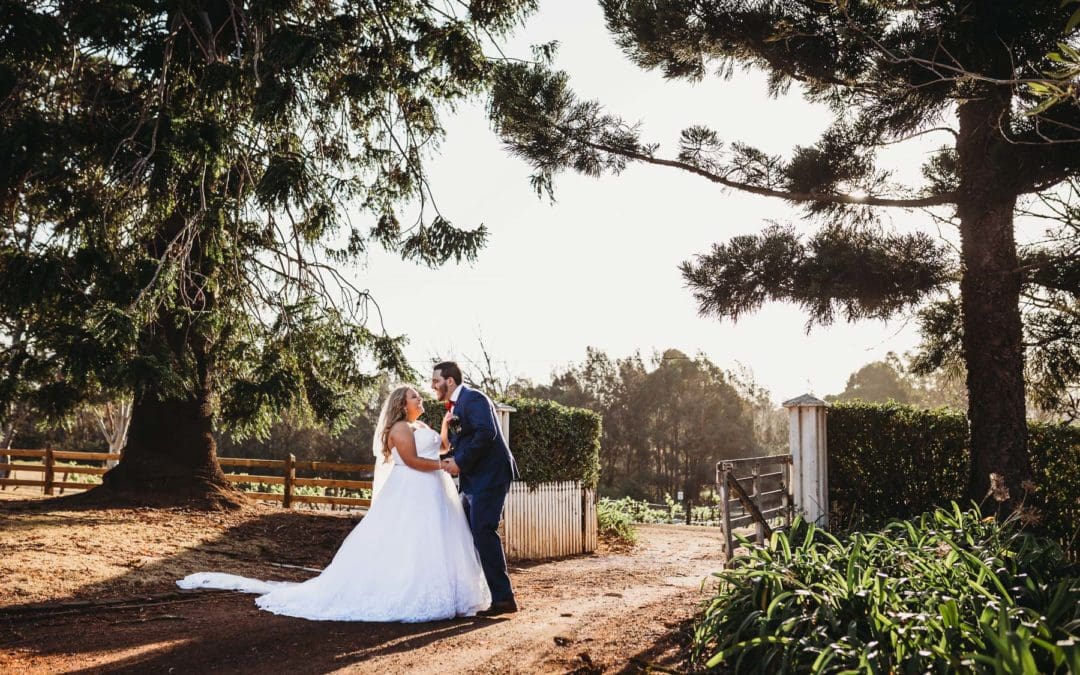 Gledswood Wedding - bride and groom hold hands in the driveway