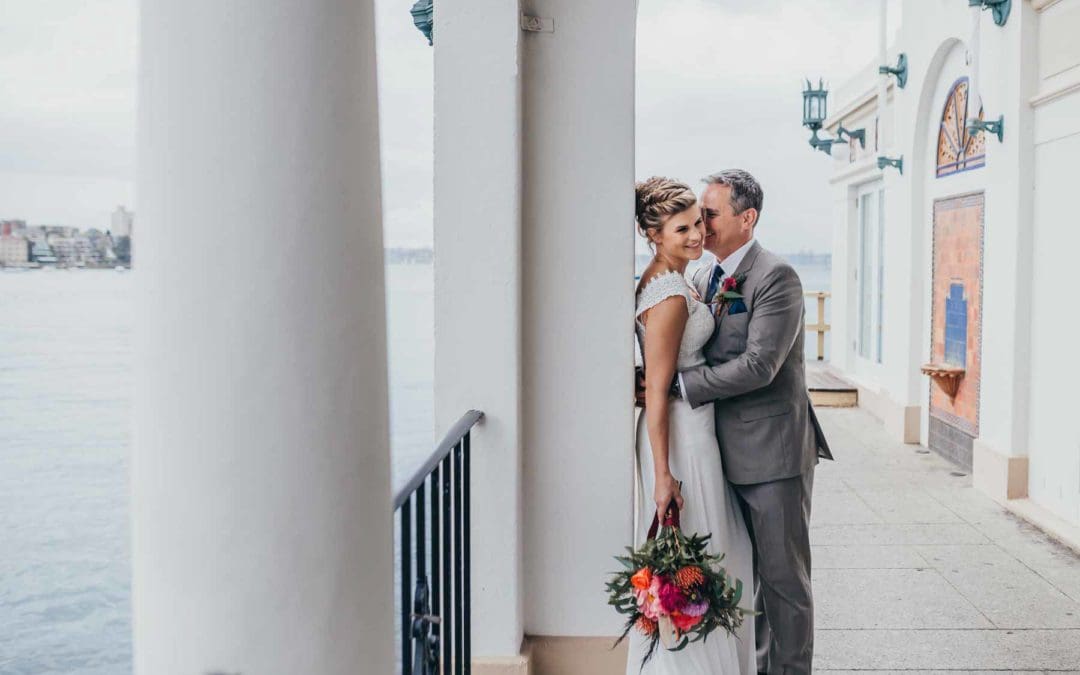 Sydney wedding photographer - A groom whispers into his brides ear