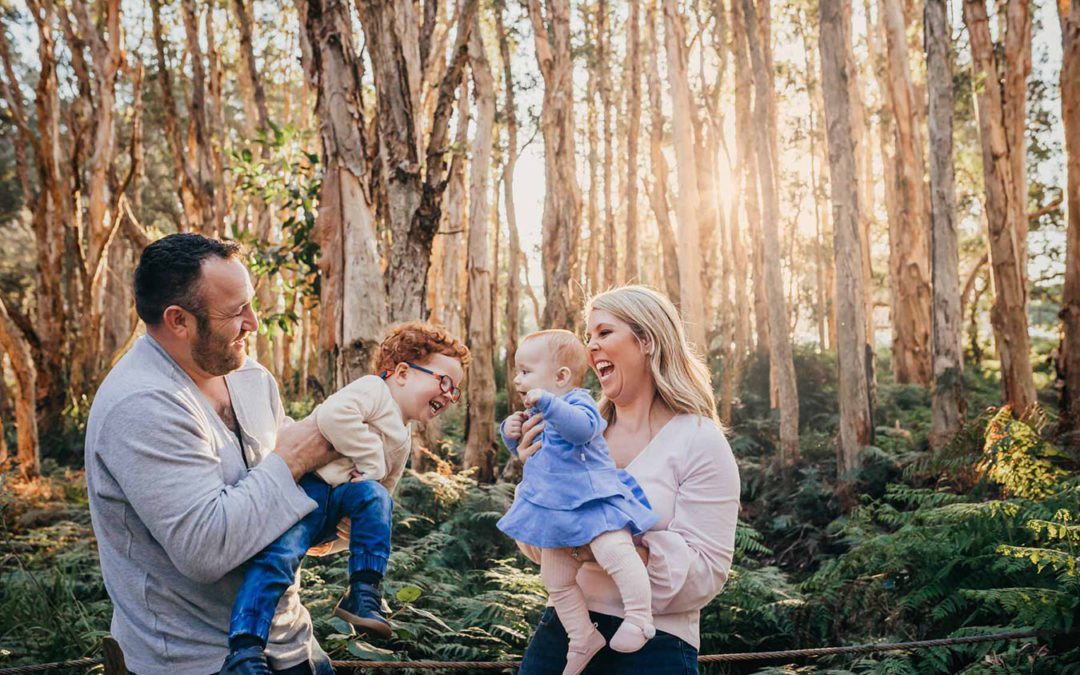 Sydney Family Photographer - a family swing their babies between them
