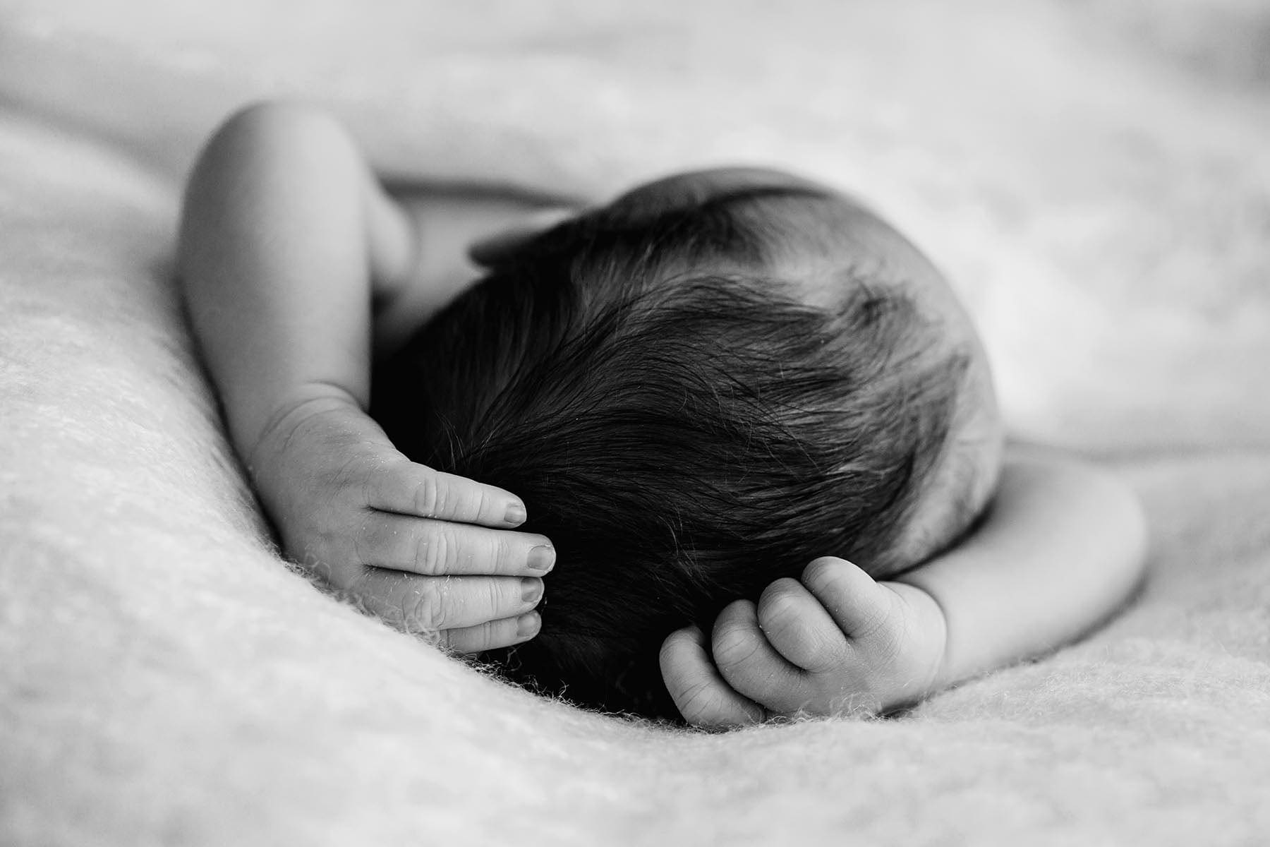 Elysium-Photography-Sydney-Newborn-Studio-Photographer-Matt-1 Newborn baby hands as they stretch up above the baby's head