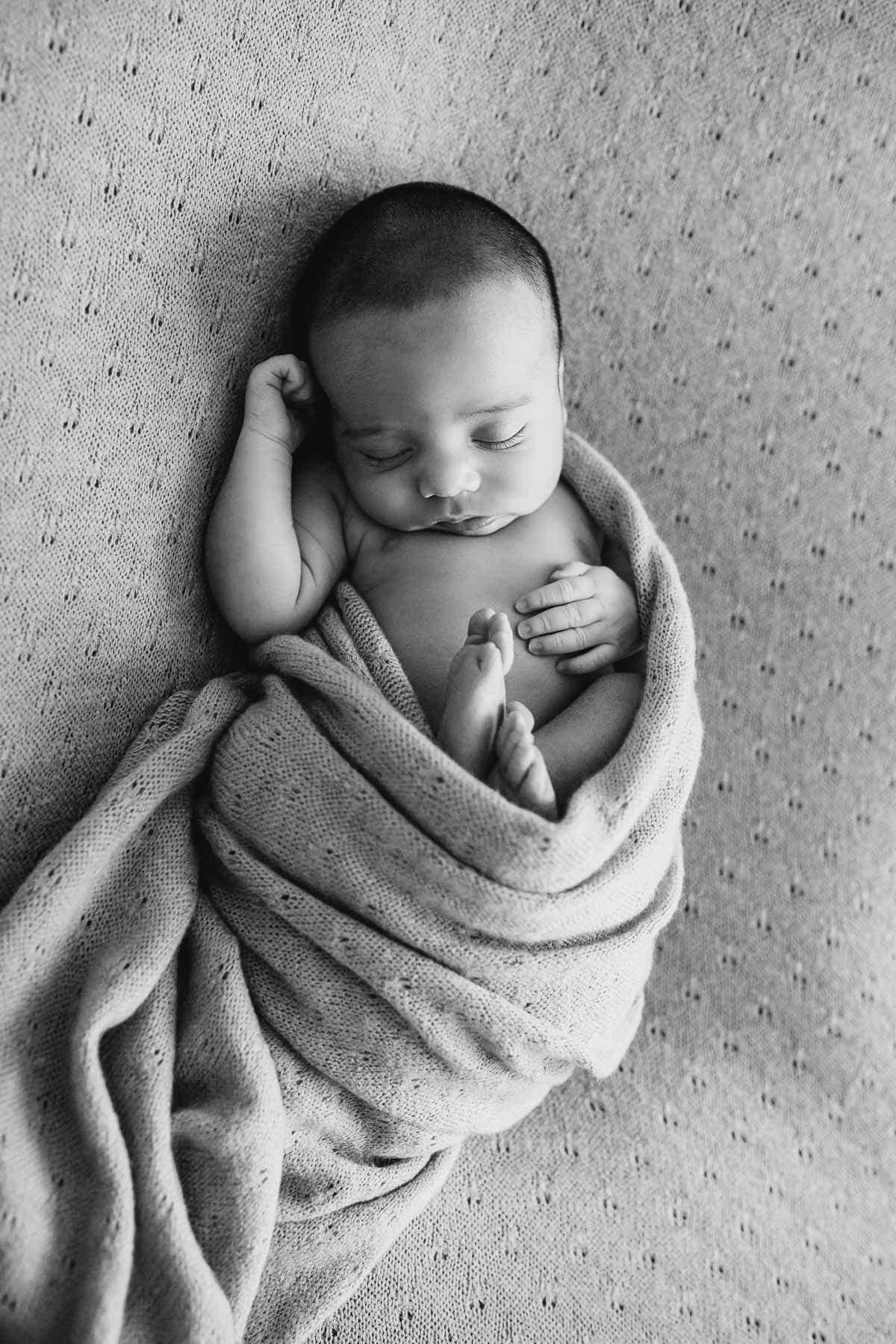 Elysium-Photography-Sydney-Newborn-Studio-Photographer-Zac-36 A newborn baby boy lays snuggly wrapped in a grey blanket