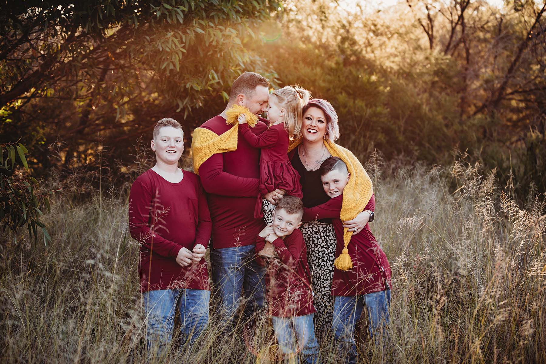 Elysium-Photography-Sydney-Outdoor-Family-Photographer-Murphy-23 Family standing in long grass, at sunset, cuddling together