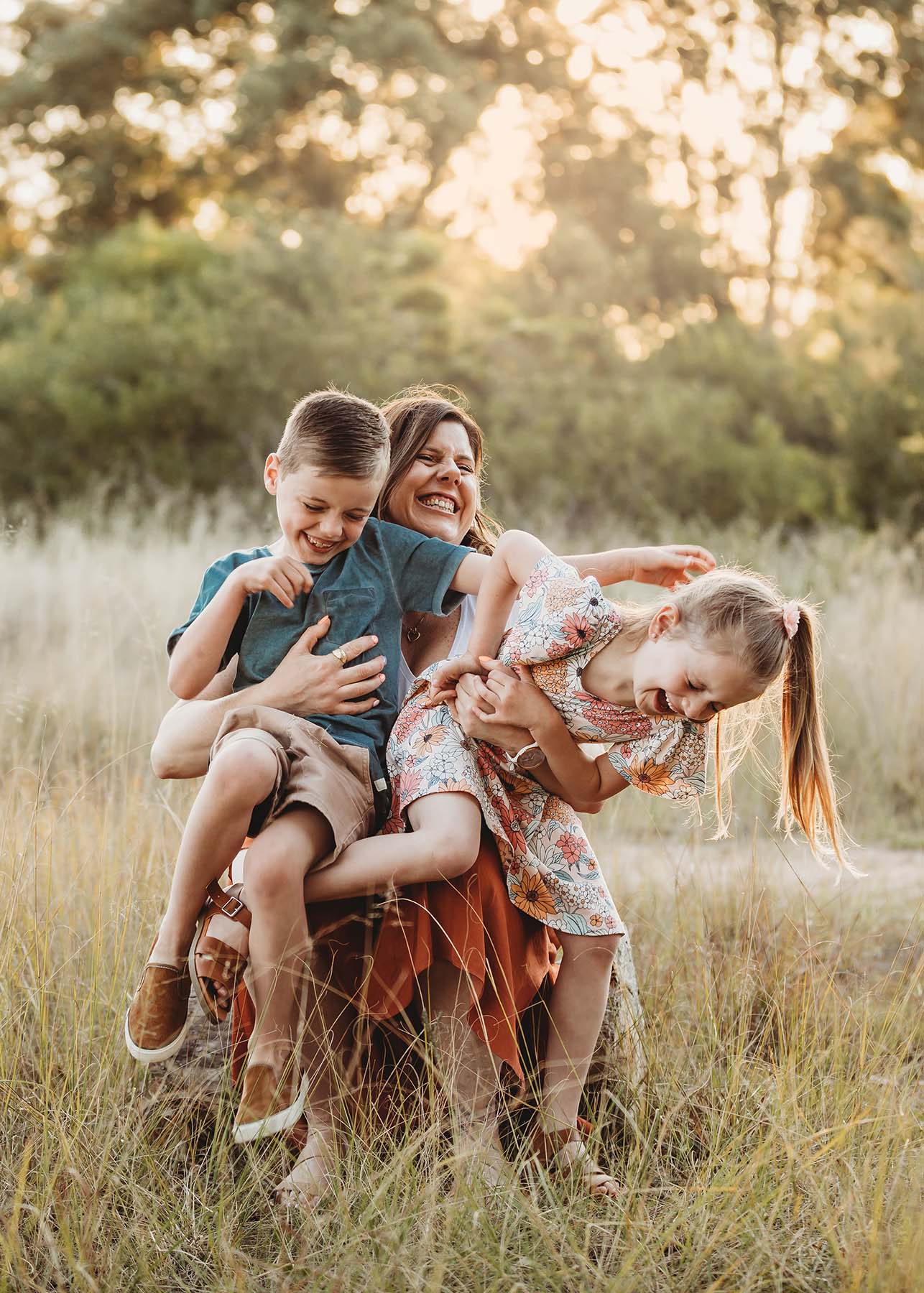 Elysium-Photography-Sydney-Family-Photographer-Nerida-34 A mother tickles her children as they sit on her lap