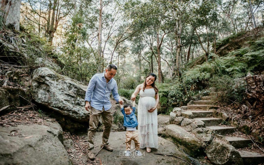 Family Session - Parents swing their baby boy between them