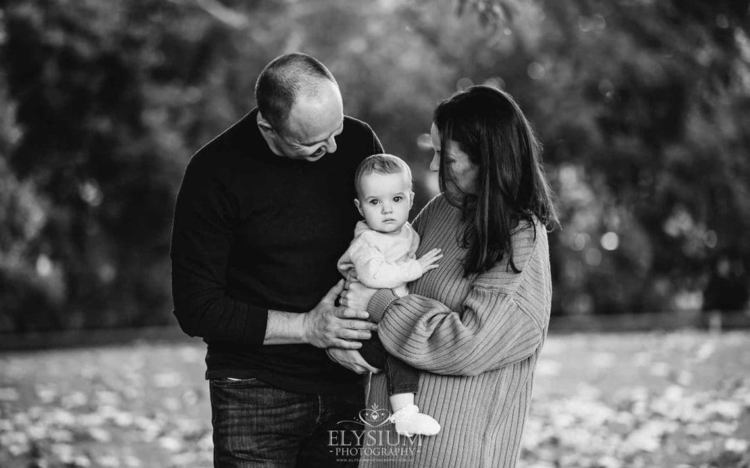 Baby photography - A family cuddle their baby girl between them