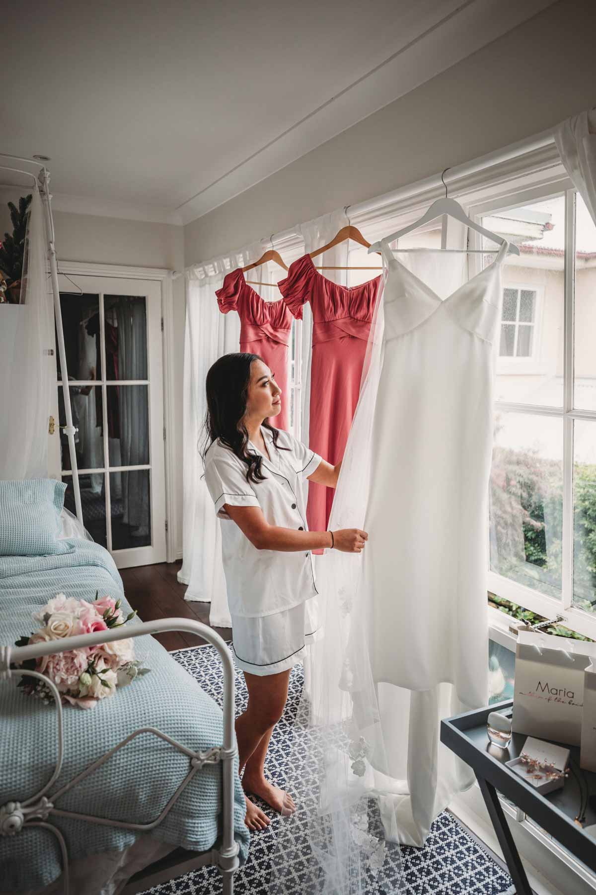 A bride preparing her wedding dress before the ceremony