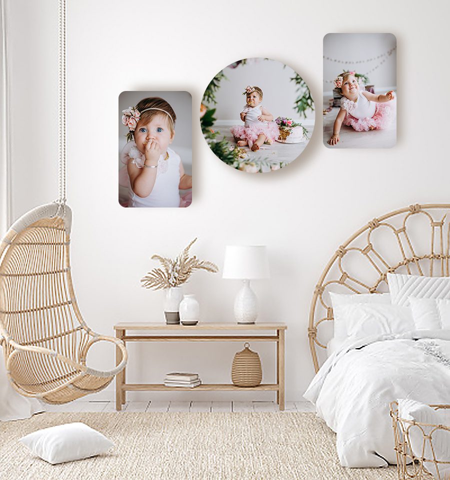 Wall art collection of wood prints displaying a baby cake smash session