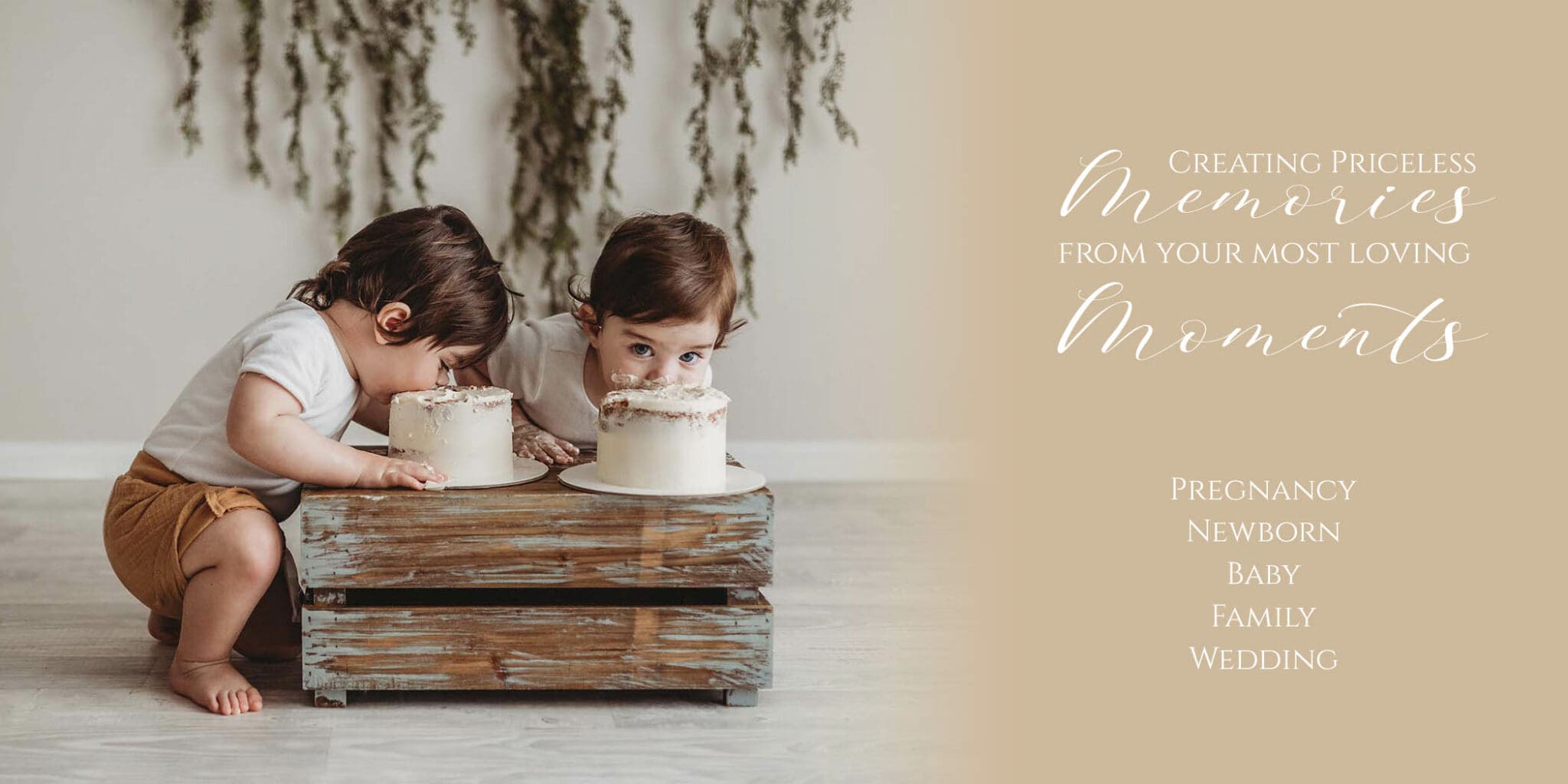 Twin baby boys eating their birthday cakes from a wooden crate in a bright Sydney studio