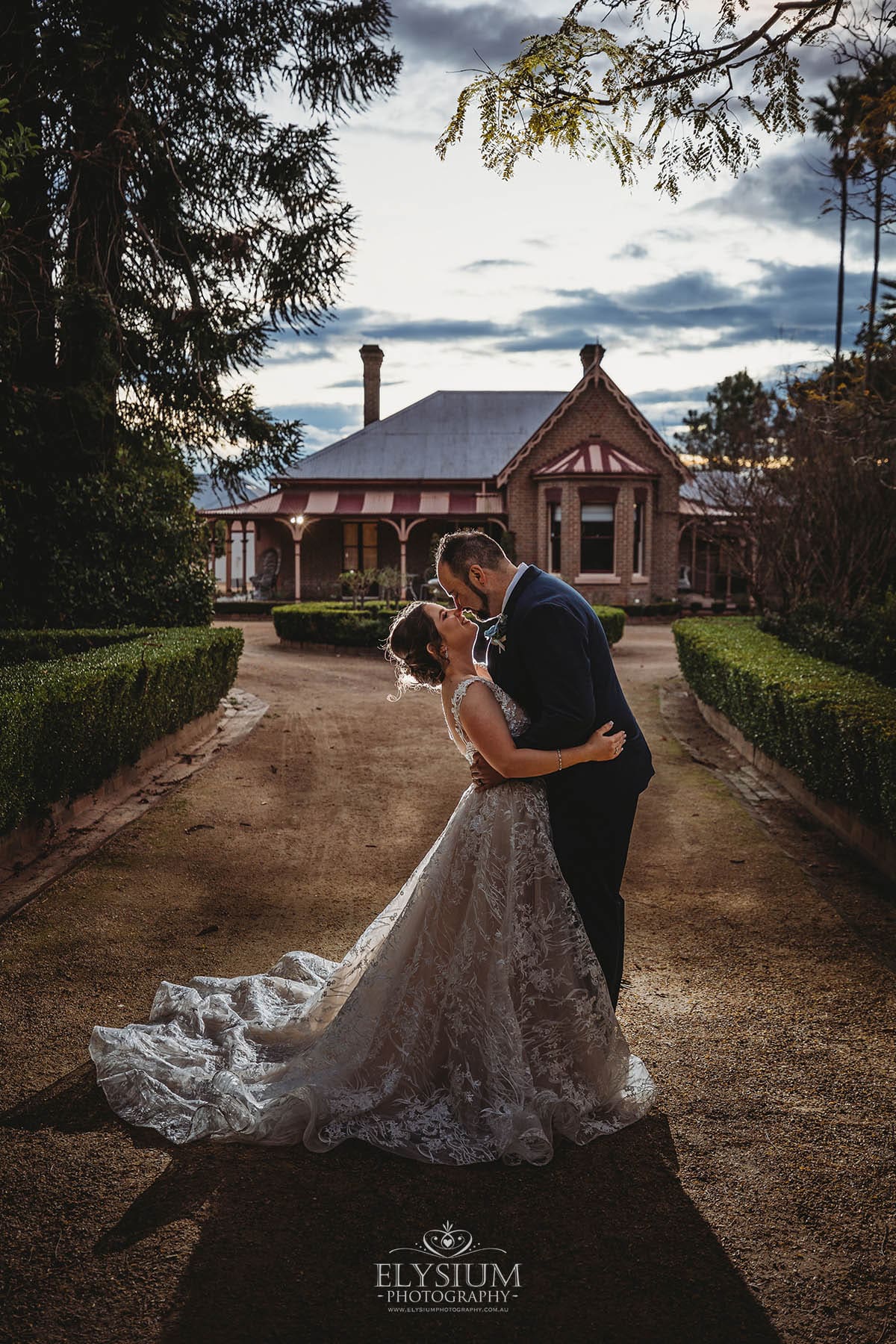 Elysium-Photography-Burnham-Grove-Wedding-Photographer-JC-807 Gledswood Wedding Photo - bride and groom stand under the arch during the ceremony