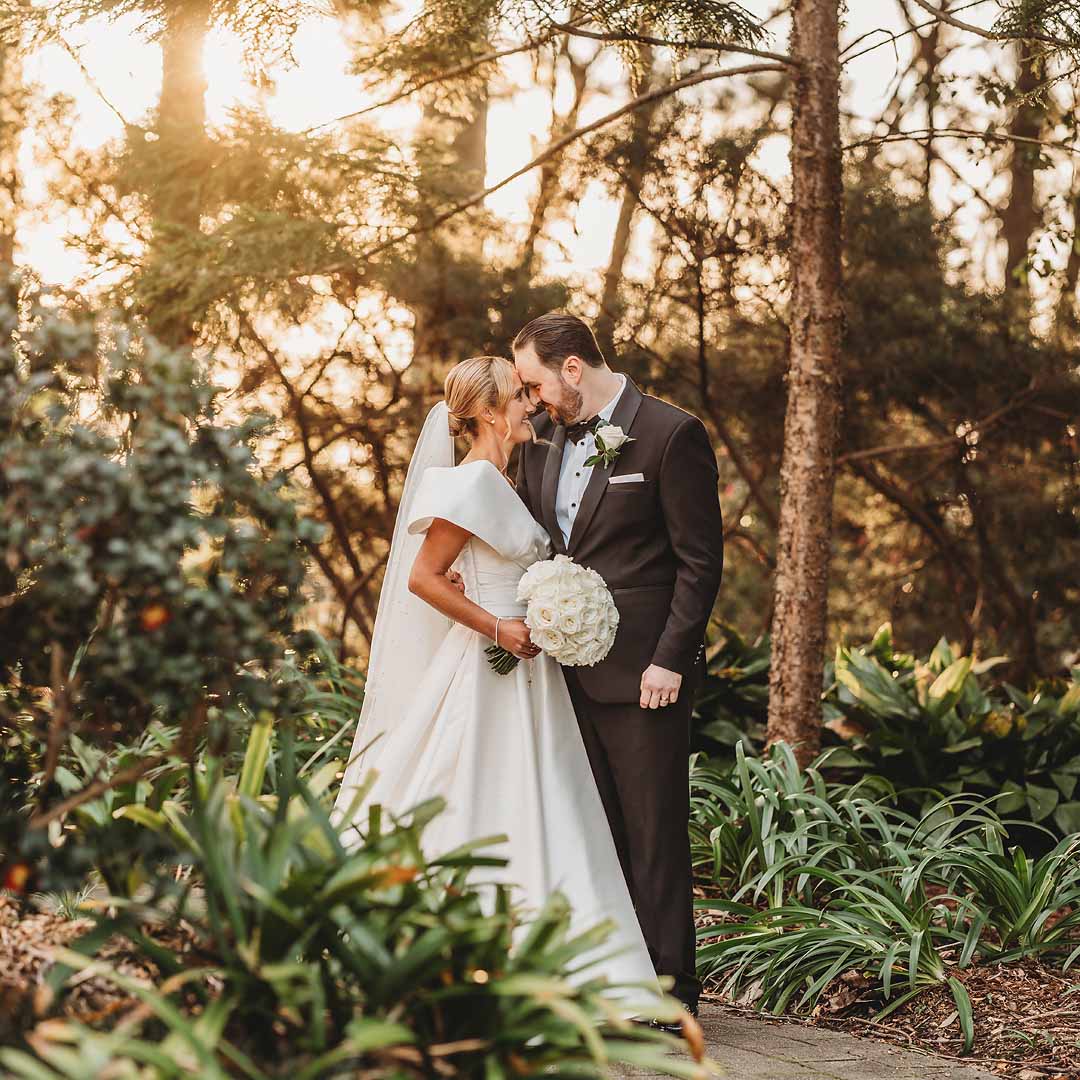 Elysium-Photography-Sydney-Wedding-Photographer-Wilson-740 A little girl lays on a white fur rug cuddling her newborn baby sister