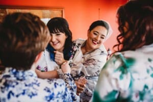 Sydney Wedding Photographer - bride hugging her bridesmaids