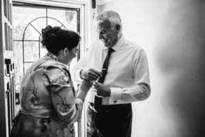 Sydney Wedding Photographer - bride helping her father with his cufflinks
