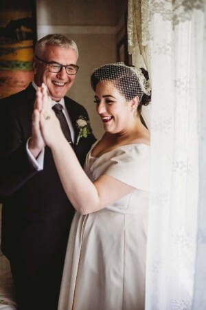Sydney Wedding Photographer - bride holding hands with her father
