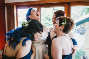 Sydney Wedding Photographer - bride hugging her bridesmaids