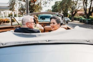 Sydney Wedding Photographer - bride sits with her father in the wedding car