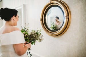Sydney Wedding Photographer - bride looks in a round mirror