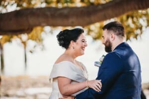 her grooms arm during the ceremony