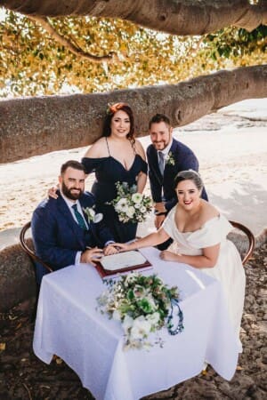 Sydney Wedding Photographer - bridal party pose with the marriage certificate