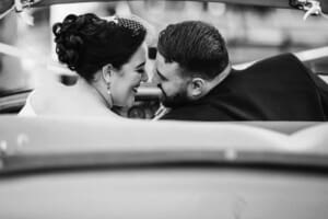 Sydney Wedding Photographer - bride and groom share a kiss in the wedding car