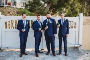 Sydney Wedding Photographer - groom shares a beer with his groomsmen