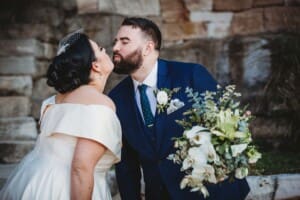Sydney Wedding Photographer - bride and groom share a kiss