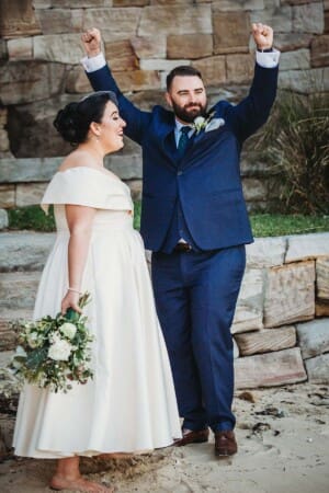Sydney Wedding Photographer - groom pumps his fists in the air triumphantly