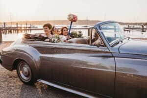 Sydney Wedding Photographer - bridal party sitting in the wedding car