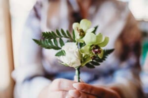 Sydney Wedding Photographer - bride holding a buttonhole flower