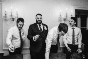 Sydney Wedding Photographer - groomsmen do shots during the reception