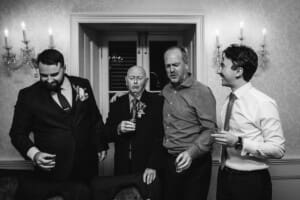 Sydney Wedding Photographer - groomsmen do shots during the reception