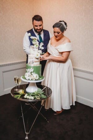 Sydney Wedding Photographer - bride and groom cut their wedding cake
