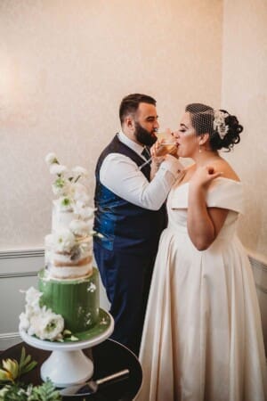 Sydney Wedding Photographer - bride and groom toast after cutting their cake