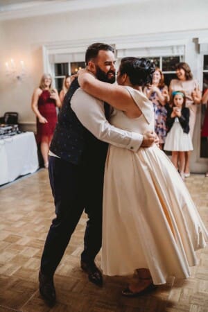 Sydney Wedding Photographer - groom twirls the bride during their first dance