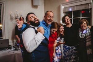 Sydney Wedding Photographer - groom sings with guests at the reception