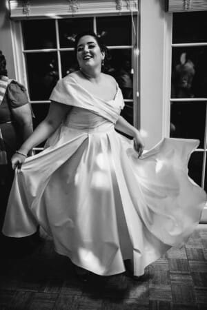 Sydney Wedding Photographer - bride twirls her gown as she dances
