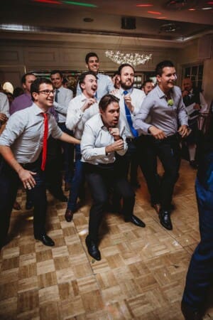 Sydney Wedding Photographer - guests prepare to catch the brides garter