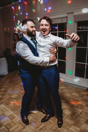 Sydney Wedding Photographer - groomsman catches the brides garter