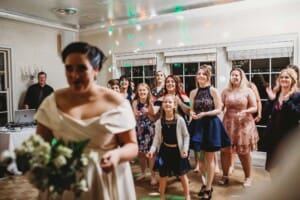Sydney Wedding Photographer - guests prepare to catch the brides bouquet