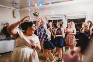 Sydney Wedding Photographer - guests prepare to catch the brides bouquet