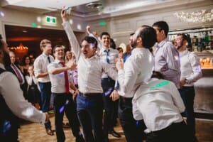Sydney Wedding Photographer - groomsman catches the brides garter