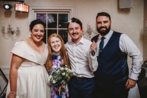 Sydney Wedding Photographer - bride and groom pose with guests who caught the garter and bouquet