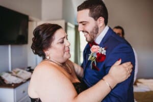 Gledswood Wedding - groom gets a hug from his mother