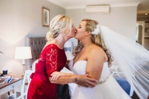 Gledswood Wedding - bride kisses her mum before the ceremony