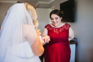 Gledswood Wedding - bride exchanges gifts with her bridesmaid