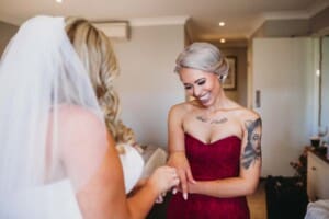 Gledswood Wedding - bride exchanges gifts with her bridesmaid