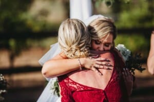 Gledswood Wedding - bride hugs her mum during the ceremony