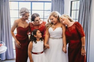 Gledswood Wedding - bride hugs her bridesmaids before the ceremony