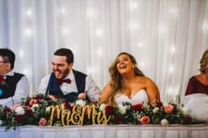 Gledswood Wedding - bride and groom laugh during the speeches