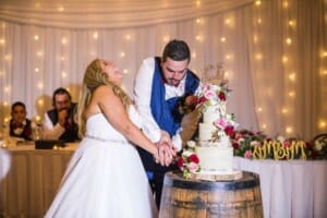 Gledswood Wedding - bride and groom cut their wedding cake
