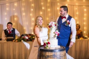 Gledswood Wedding - bride and groom cut the wedding cake